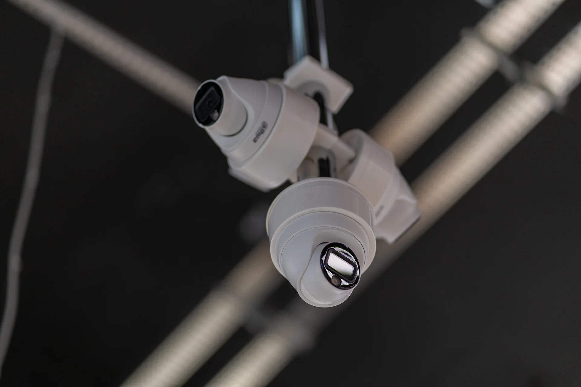 Close-up of two installed dome cameras.