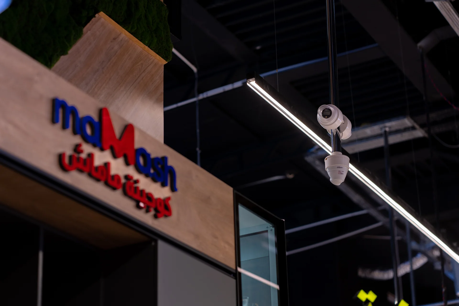The Mamash store front sign with installed cameras above it.